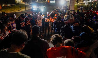 Fans gather outside the University of Cincinnati Medical Center in Cincinnati