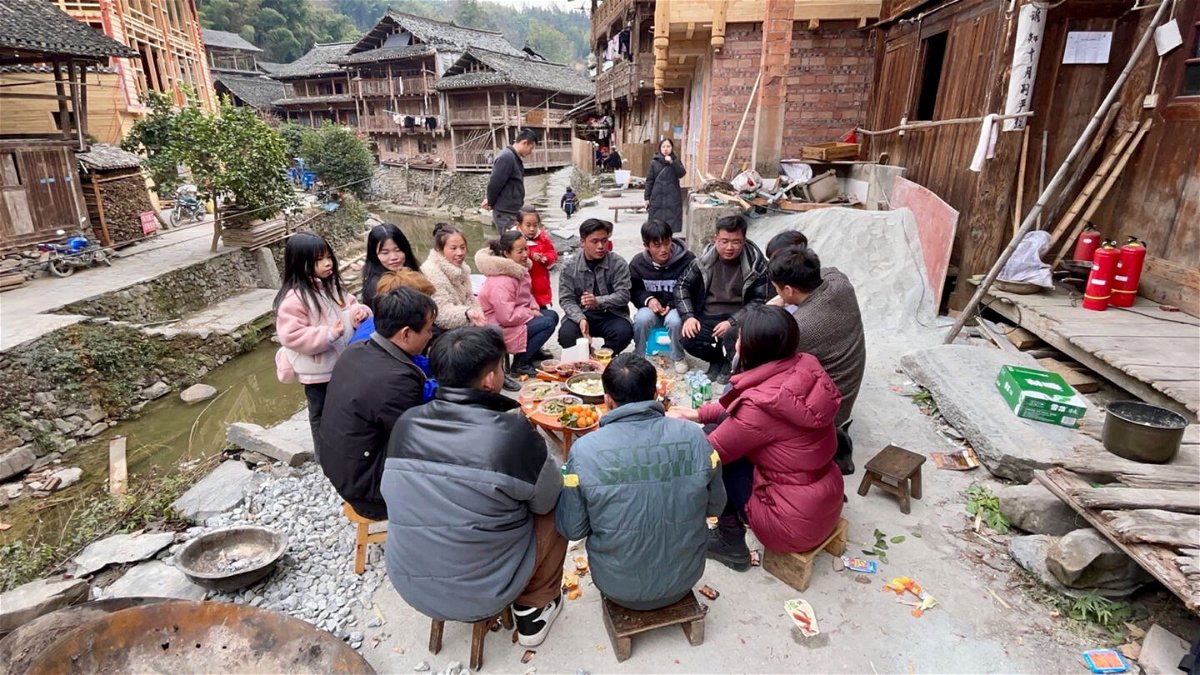 <i>CNN</i><br/>Dali villagers gather around a short table for their Lunar New Year feast.