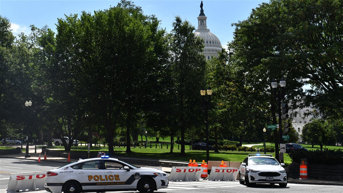 US Capitol police block a street during an investigation of a possible bomb threat near the US Capitol and Library of Congress in Washington