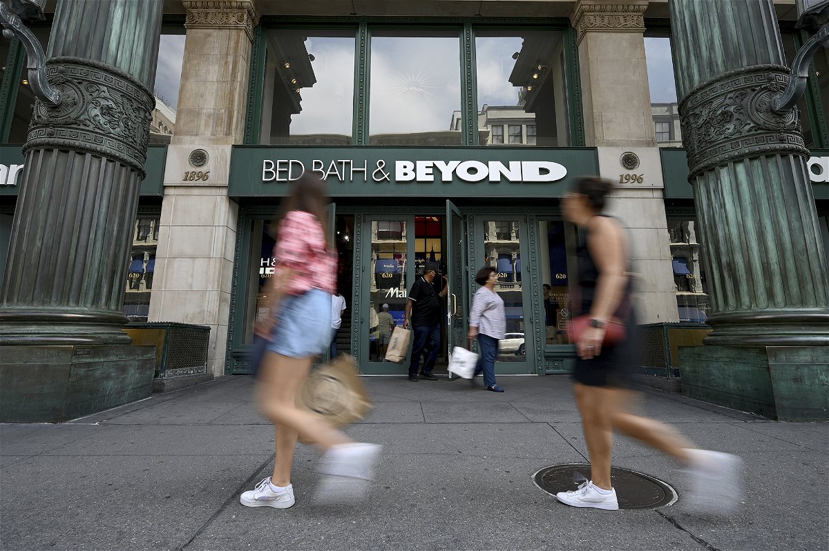 <i>Anthony Behar/Sipa USA/AP</i><br/>People walk past the entrance to a Bed Bath & Beyond retail store along Sixth Avenue in New York in September of 2022.