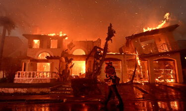 Firefighters battle a brush fire that destroyed several homes in Laguna Niguel