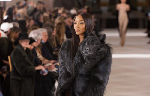 Naomi Campbell wore a glossy black coat complete with the protruding wolf's head.