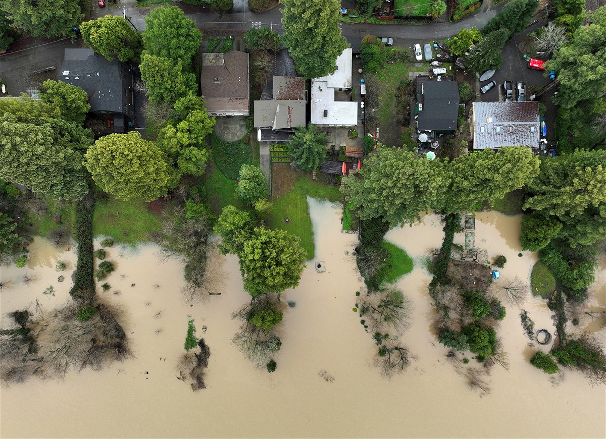<i>Fred Greaves/Reuters</i><br/>Floodwater from the Russian River approaches homes Sunday following a chain of winter storms