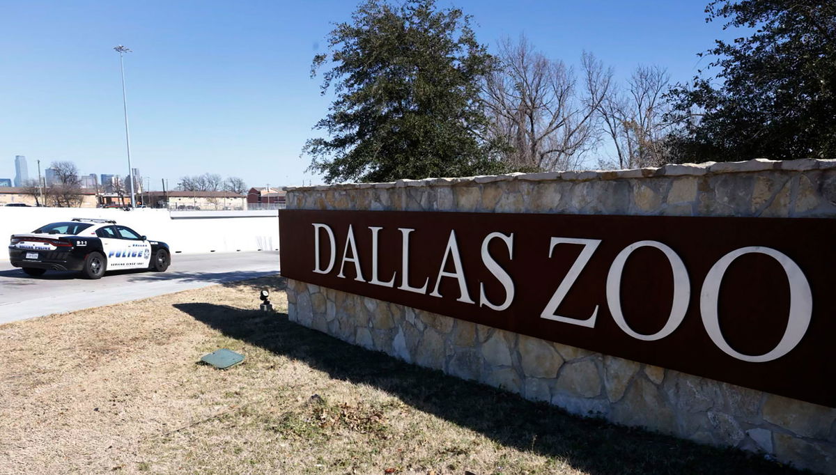 <i>Shakfat Anowar/The Dallas Morning News/AP</i><br/>A Dallas police vehicle sits at an entrance to the Dallas Zoo on Friday morning.