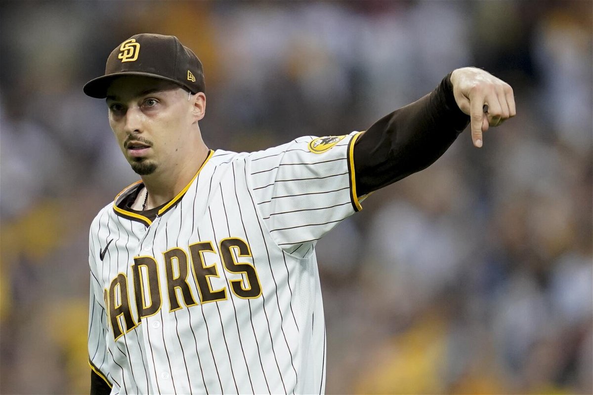 San Diego Padres starting pitcher Blake Snell reacts after striking out Los Angeles Dodgers' Will Smith during the first inning in Game 3 of a baseball NL Division Series, Friday, Oct. 14, 2022, in San Diego. (AP Photo/Ashley Landis)