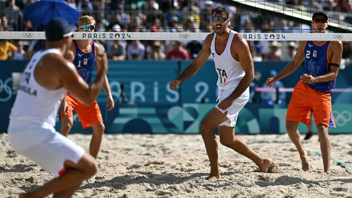 Italy plays the Netherlands in the men's beach volleyball tournament.