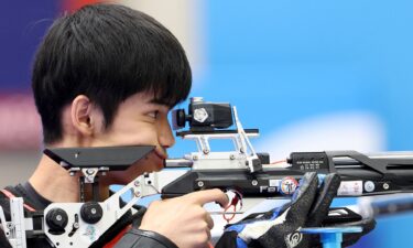 China's Sheng Lihao competes in the shooting 10m Air Rifle Mixed Team final