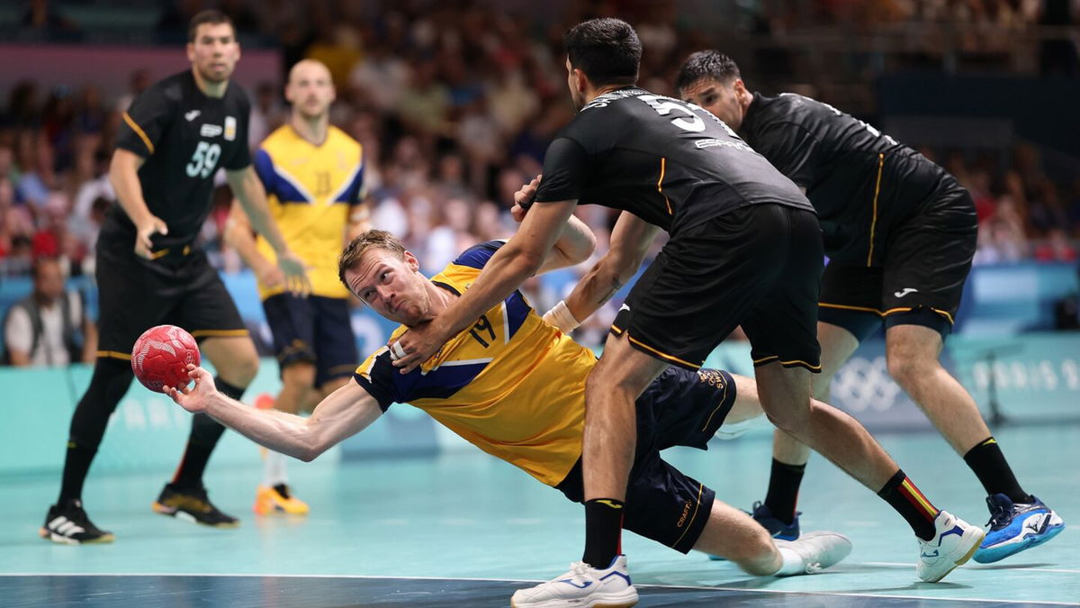 Sweden and Spain compete in men's handball.