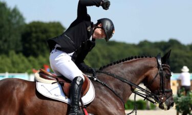 Gold medalists Michael Jung and horse Chipmunk FRH of Team Germany celebrate after their victory in the Eventing Individual Final on day three of the Olympic Games Paris 2024 at Chateau de Versailles on July 29