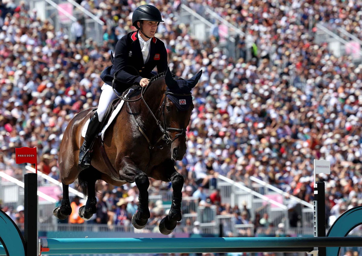 Tom McEwen and horse JL Dublin of Team Great Britain compete during the Eventing Jumping Team Final and Individual Qualifier on day three of the Olympic Games Paris 2024 at Chateau de Versailles on July 29