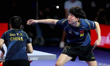 Chuqin Wang of China competes in a mixed doubles semifinal during the 2021 World Table Tennis Championships Finals at George R