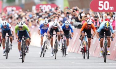 Tadej Pogacar of Team Slovenia bronze medal & Wout van Aert of Team Belgium silver medalist sprints on arrival during the Men's road race at the Fuji International Speedway on day one of the Tokyo 2020 Olympic Games