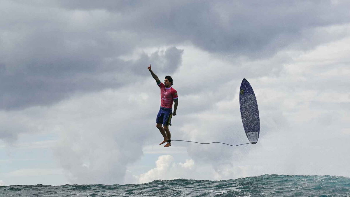 Gabriel Medina puts up No. 1 as he flies through the air