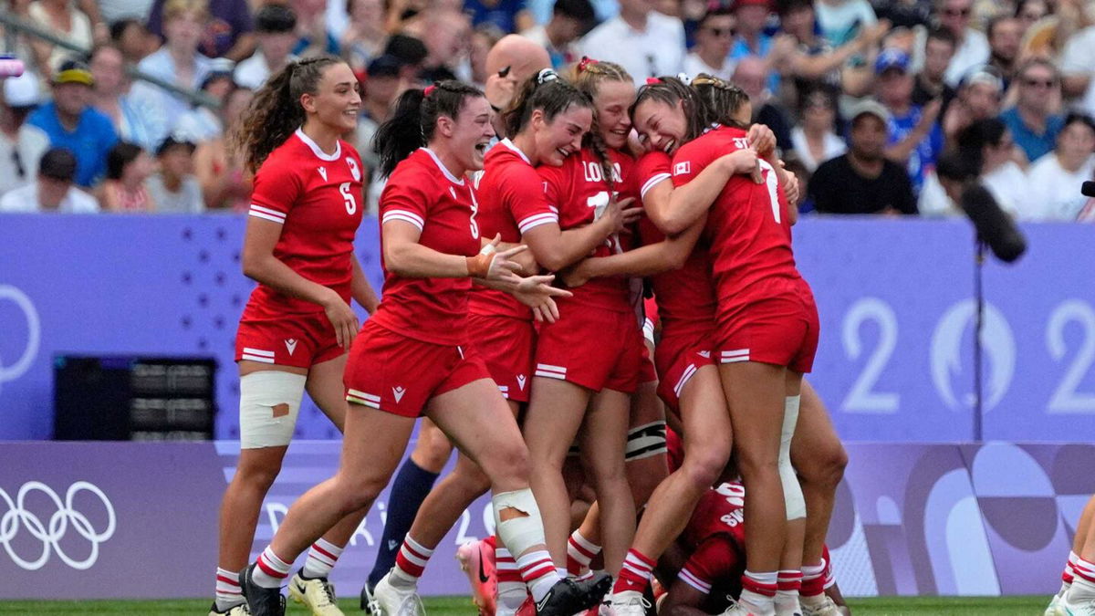 Canada celebrates after their victory over Australia.