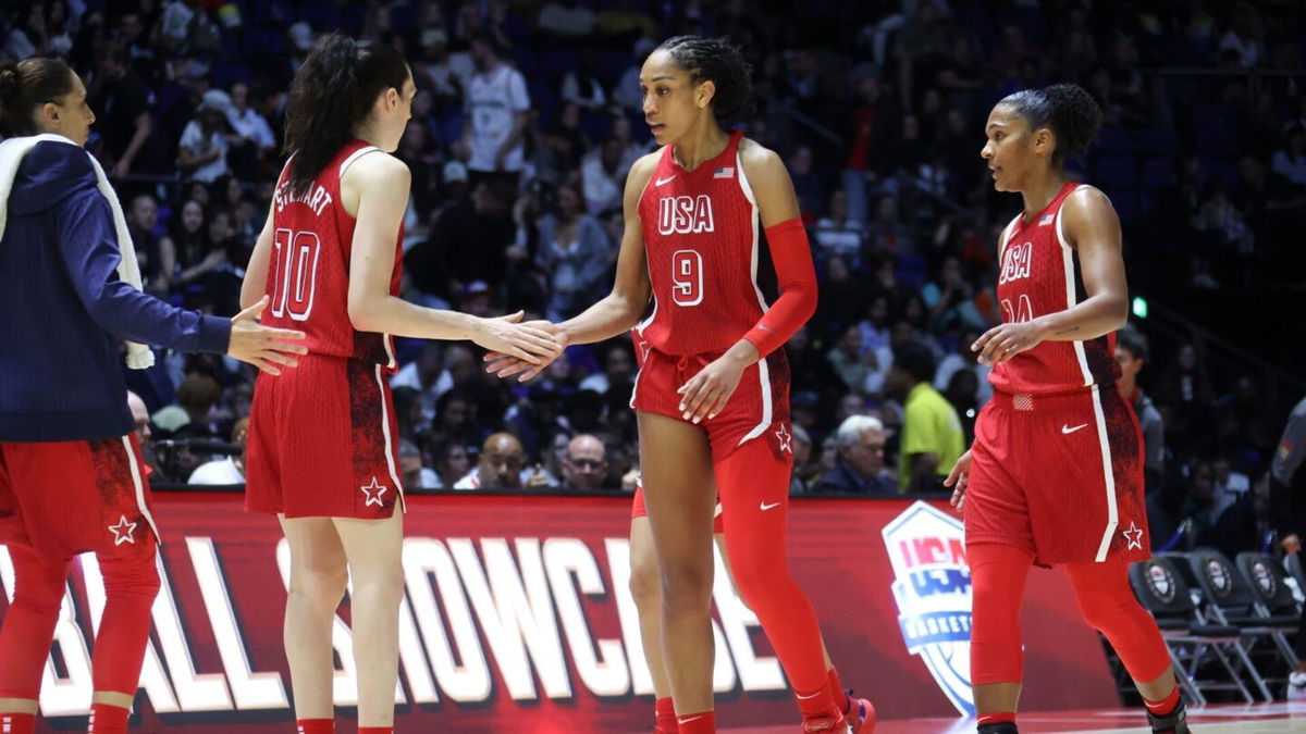 Diana Taurasi and Breanna Stewart greet A'ja Wilson during a U.S. basketball game