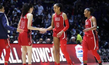 Diana Taurasi and Breanna Stewart greet A'ja Wilson during a U.S. basketball game