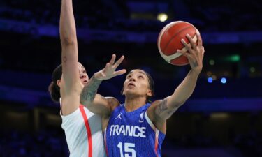 Gabby Williams tries a layup against Canada