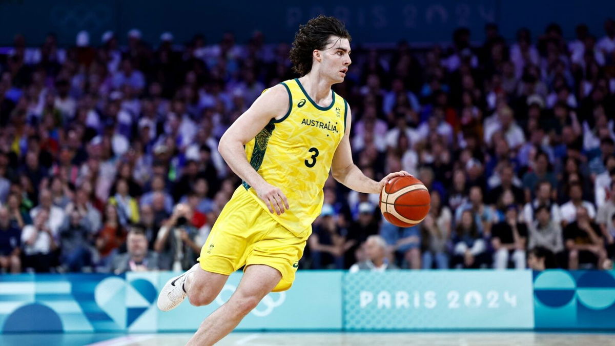 Josh Giddey dribbles during Australia's game against Spain