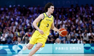 Josh Giddey dribbles during Australia's game against Spain