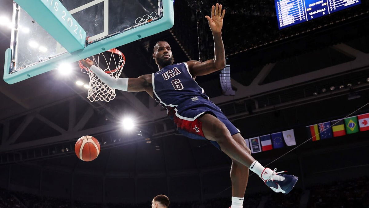 LeBron James dunks the ball against Serbia