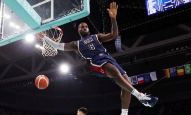 LeBron James dunks the ball against Serbia