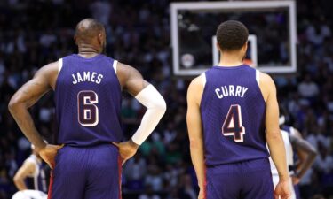 LeBron James and Stephen Curry look on during a U.S. men's basketball game