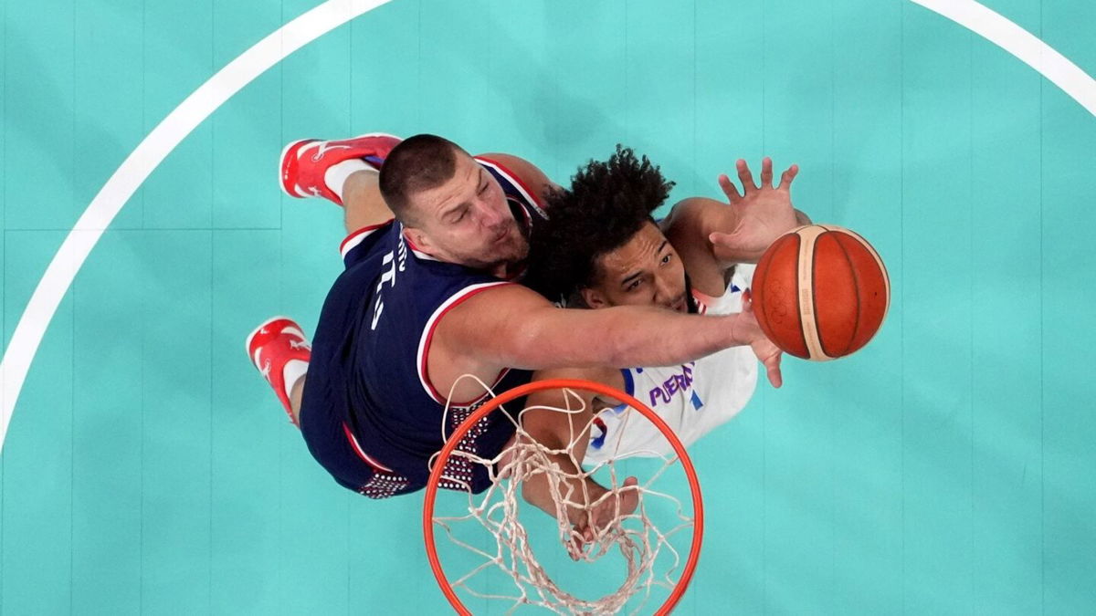 Nikola Jokic goes up for a rebound against Puerto Rico