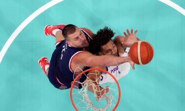 Nikola Jokic goes up for a rebound against Puerto Rico