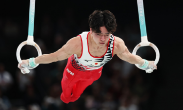 Shinnosuke Oka of Japan competes on the rings during the all-around final at the 2024 Paris Olympics.