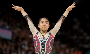 Rina Kishi of Japan reacts after finishing her balance beam routine during women's Qualification at the 2024 Paris Olympic Games.