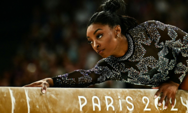 Simone Biles competes on the balance beam during qualifications at the Paris 2024 Olympic Games.