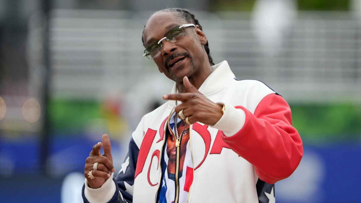 Snoop Dogg poses for a photo