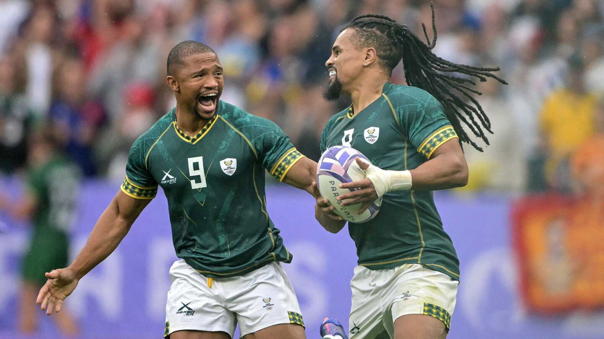 Selyvn Davids and Shaun Williams celebrate