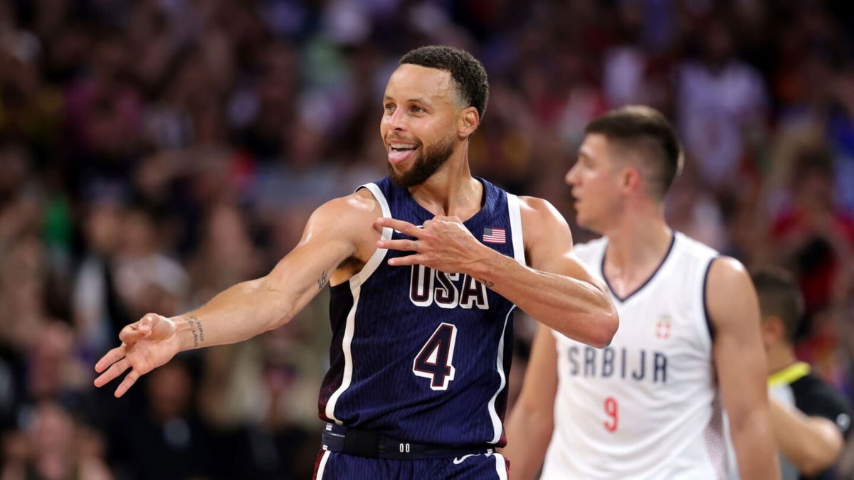 Steph Curry reacts after hitting a 3 vs. Serbia