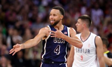 Steph Curry reacts after hitting a 3 vs. Serbia