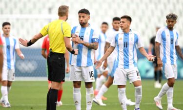 Argentina players talk to the referee.