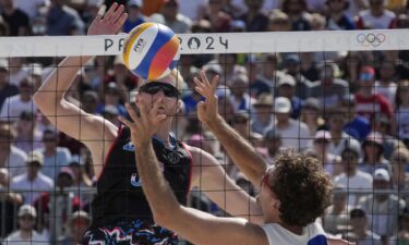 Chase Budinger (USA) and Arnaud Gauthier-Rat (FRA) in action in a beach volleyball preliminary phase match during the 2024 Paris Olympics.