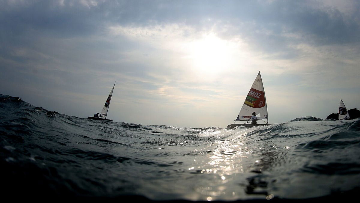 Deizy Nhaquile of Team Mozambique crosses the line at the end of the second Women's Laser Radial Class race on Day Two of the 2020 Tokyo Olympics.