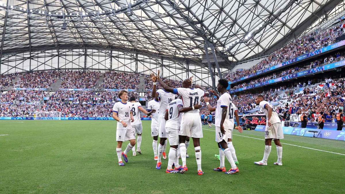 France players celebrate after scoring a goal