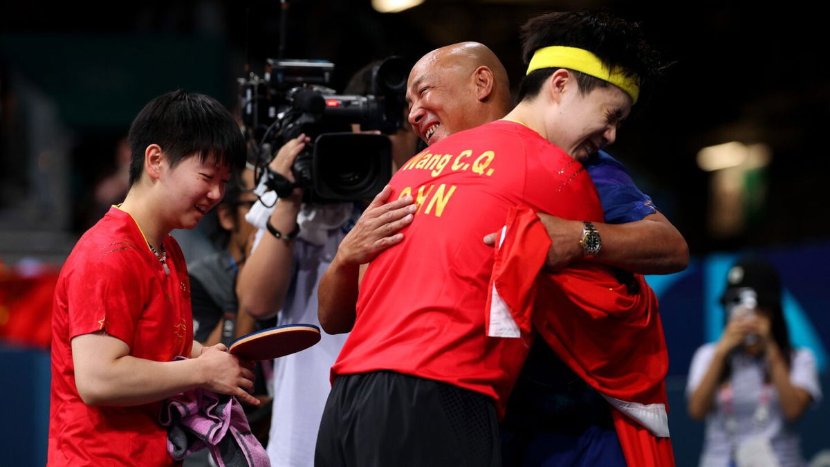 Yingsha Sun and Chuqin Wang of Team China celebrate their victory in the table tennis mixed doubles gold medal match at the 2024 Paris Olympics.