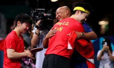 Yingsha Sun and Chuqin Wang of Team China celebrate their victory in the table tennis mixed doubles gold medal match at the 2024 Paris Olympics.