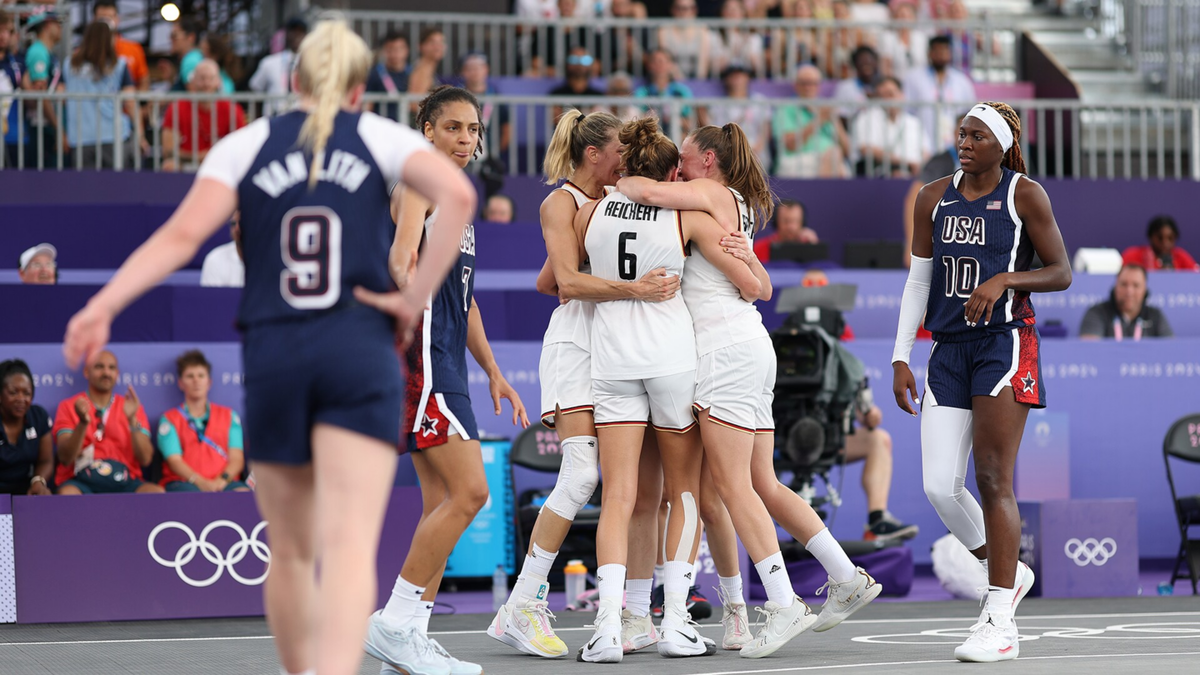 Germany athletes celebrate a victory on Day 4 of the Olympic Games at Esplanade Des Invalides on July 30