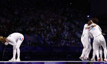 Italian women's epee team celebrate next to French Auriane Mallo