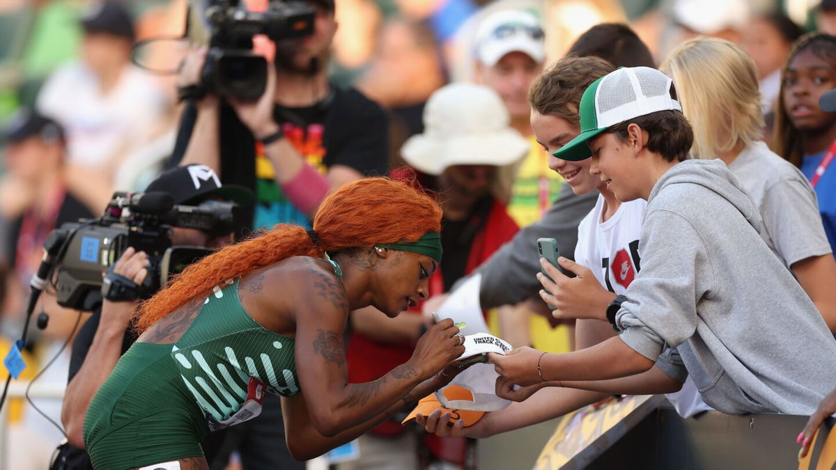 Sha'Carri Richardson signs autographs for fans following the Women's 100m Semi Final during the 2023 USATF Outdoor Championships at Hayward Field on July 07