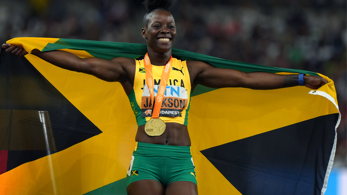 Shericka Jackson poses for a photograph after winning the women's 200m race at the 2023 World Athletics Championships.