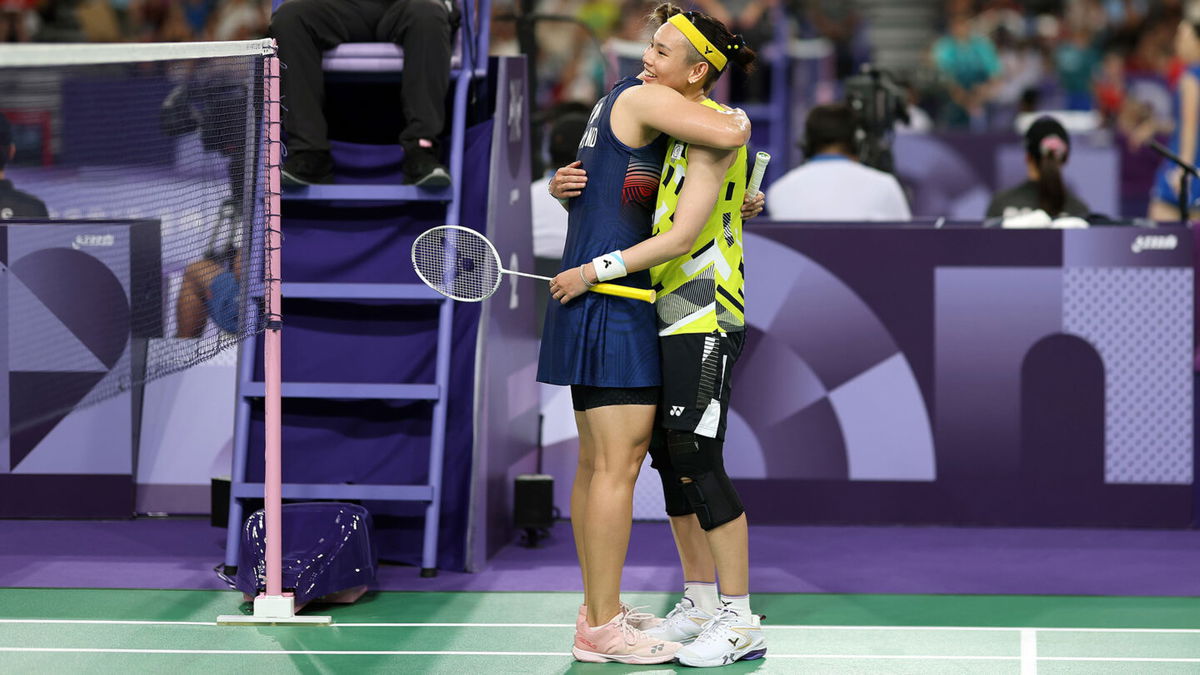 Ratchanok Intanon of Thailand hugs Tzu Yin Tai of Chinese Taipei at the end of the Badminton Women's Singles Group Play Stage match on day five of the Paris Olympic Games.