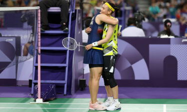 Ratchanok Intanon of Thailand hugs Tzu Yin Tai of Chinese Taipei at the end of the Badminton Women's Singles Group Play Stage match on day five of the Paris Olympic Games.