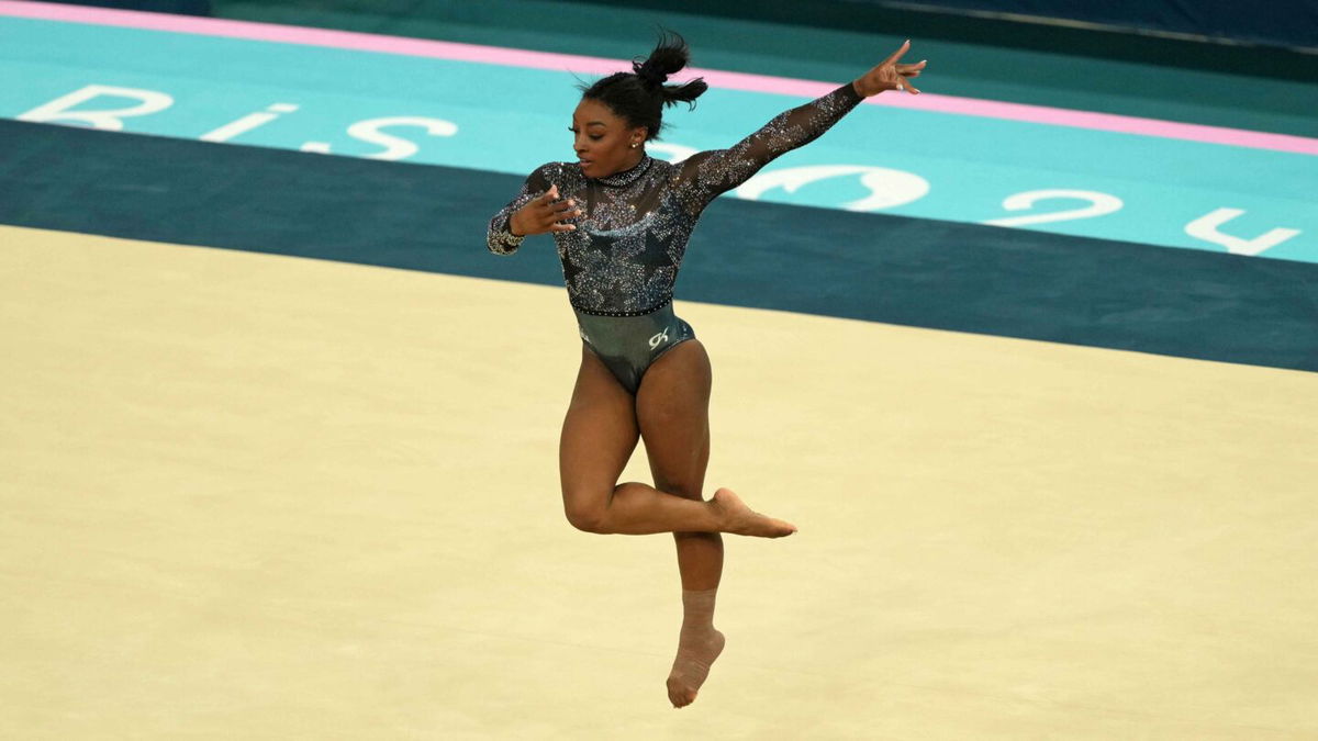 Simone Biles of the United States performs on the floor exercise in womenís qualification during the Paris 2024 Olympic Summer Games at Bercy Arena.