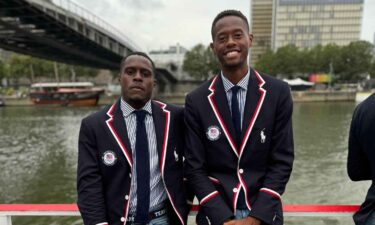 Olympians and former high school classmates Christian Coleman (track and field) and Chris Eubanks (tennis) pose together on the Team USA boat during the Opening Ceremony in Paris.