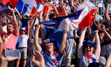 France fans celebrate during the menís canoe single final during the Paris 2024 Olympic Summer Games at Vaires-sur-Marne Nautical Stadium.